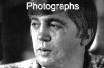In a photograph Buford Pusser is serious, has black hair, wearing a checkered top.