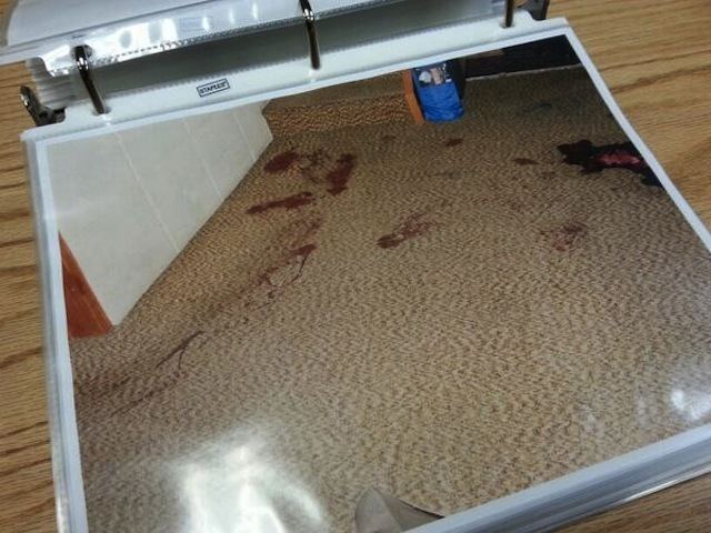 Blood stained carpet on a crime scene