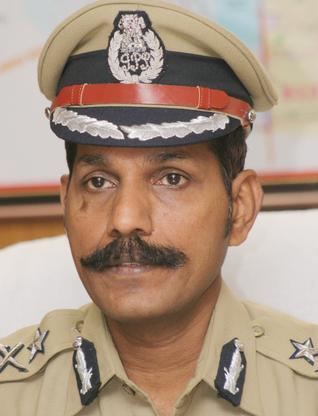 C. Sylendra Babu wearing police officer uniform