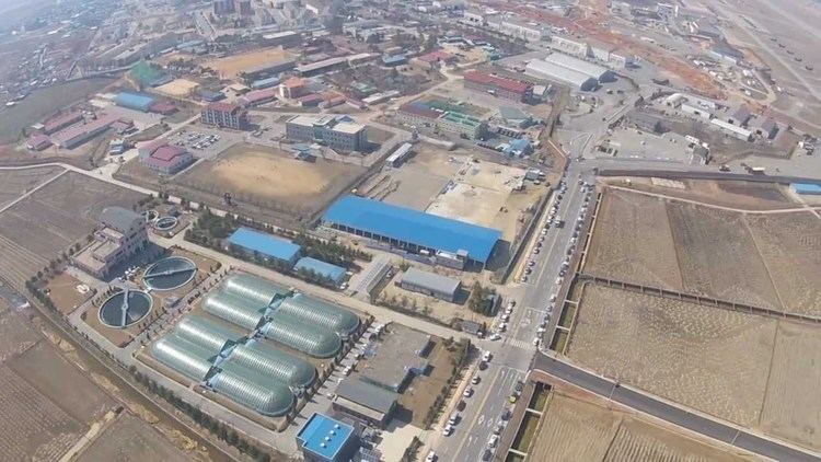 Aerial view of Camp Humphreys surrounded by rice fields in South Korea.