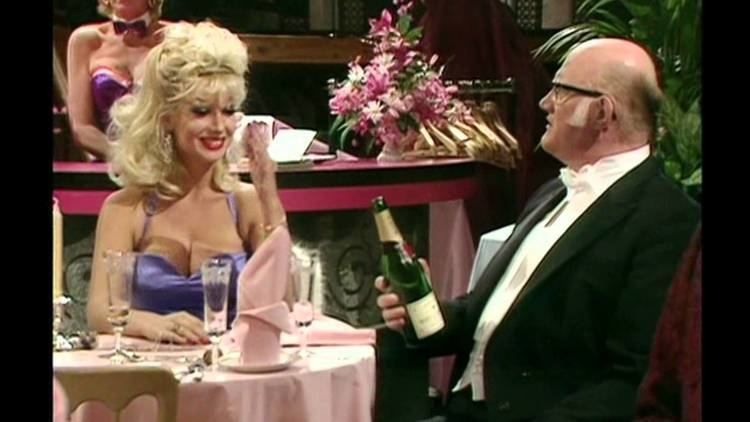Candy Davis and Nicholas Smith in the restaurant in a scene from the 1972 tv series Are You Being Served?