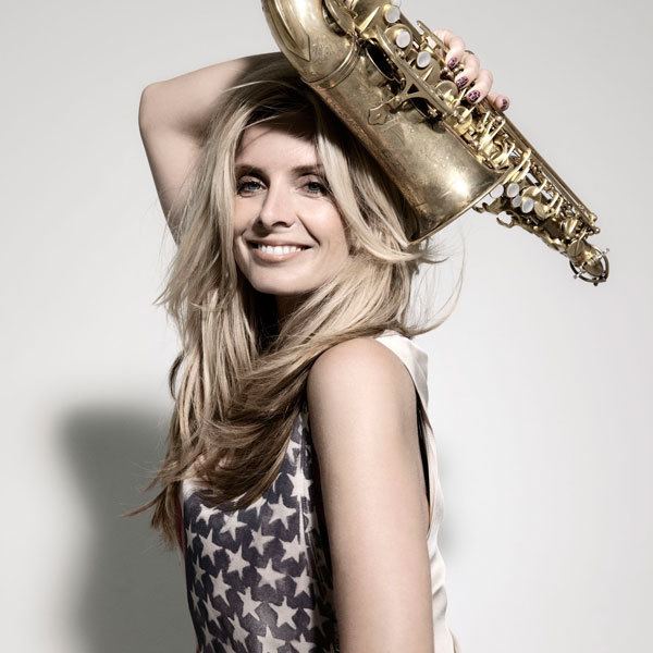 Candy Dulfer holding a saxophone