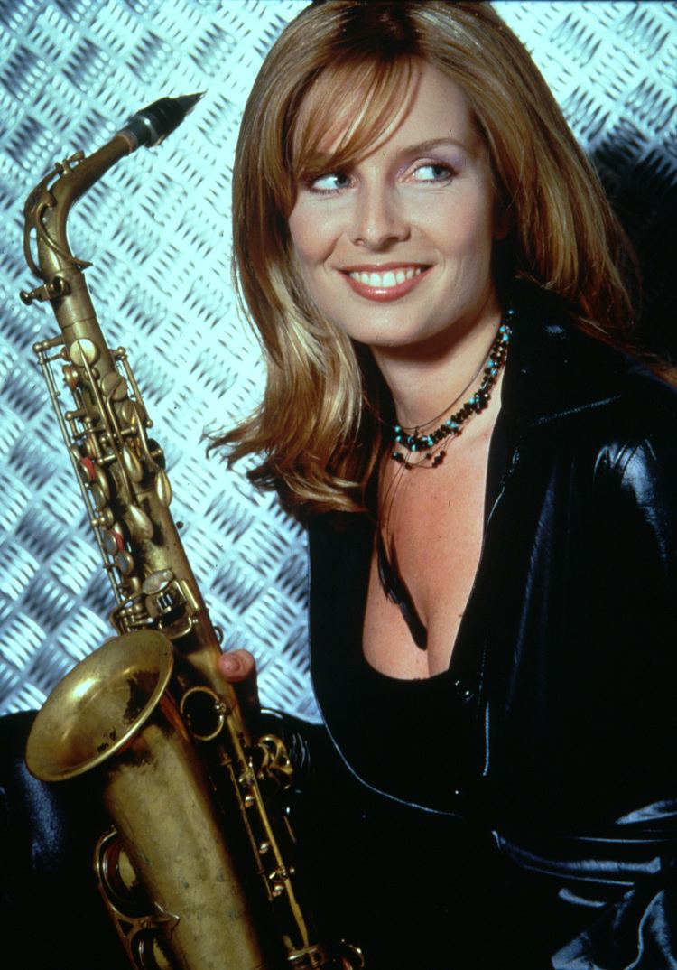 Candy Dulfer holding her saxophone