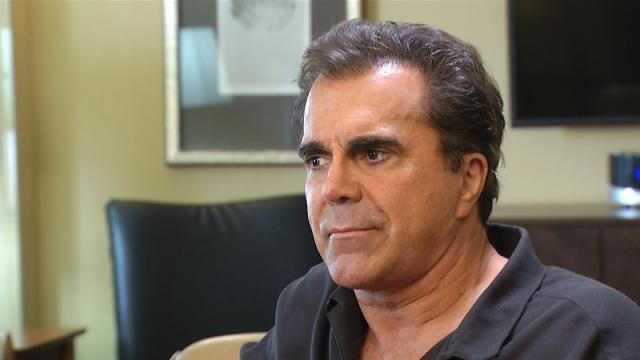 Carman, in one of his interviews, wearing a black polo
