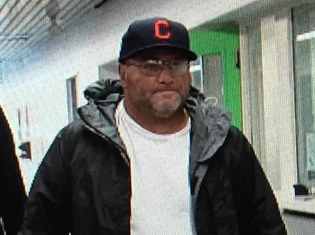 Carmine Agnello wearing cap, eyeglasses, black jacket and white t-shirt when he released on $100,000 bond