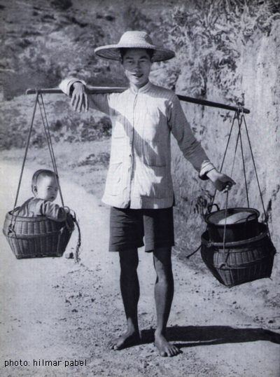 Carrying pole Baby carrying Chinese father By Hilmar Pabel Carrying a child in a