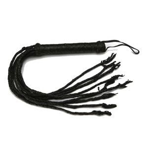 An all black Cat o' nine tails, a type of multi-tailed whip that originated as an implement for severe physical punishment.
