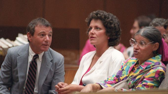 Cathy Smith, center, in court on charges in death of John Belushi, 1986