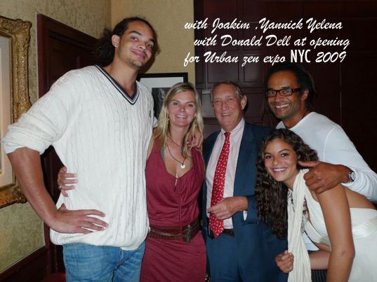 Joakim Noah smiling with Cécilia Rodhe, Donald Dell, Yannick Noah, and Yelena Noah at the opening for Urban zen, New York City