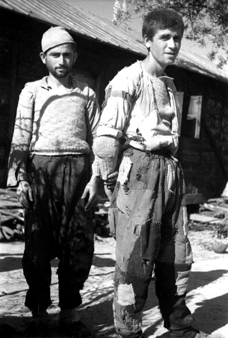 Cham Albanians Ethnic Albanian men in ragged clothing are photographed in a refugee