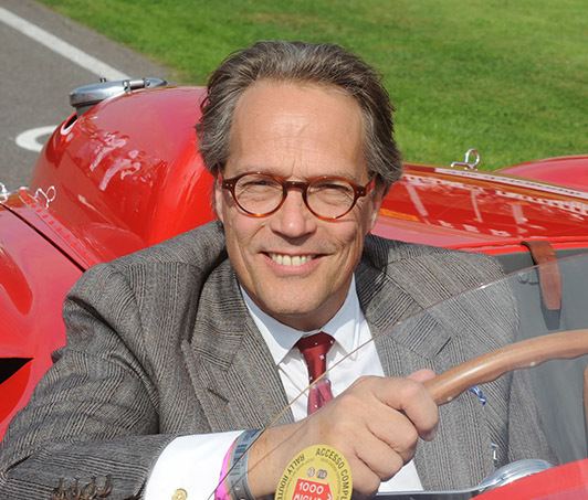 Charles Gordon Lennox, Earl of March and Kinrara smiling while driving