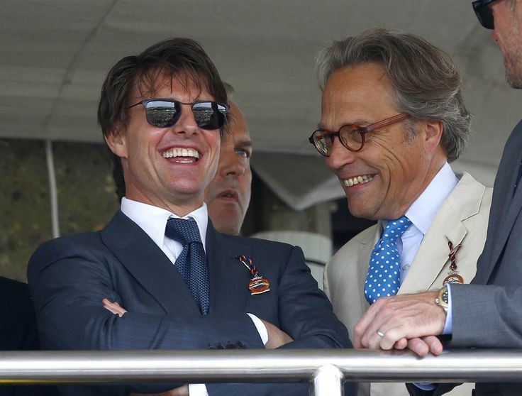 Charles Gordon-Lennox, 11th Duke of Richmond laughing with Tom Cruise at Goodwood on July 31, 2014 in Chichester, England.