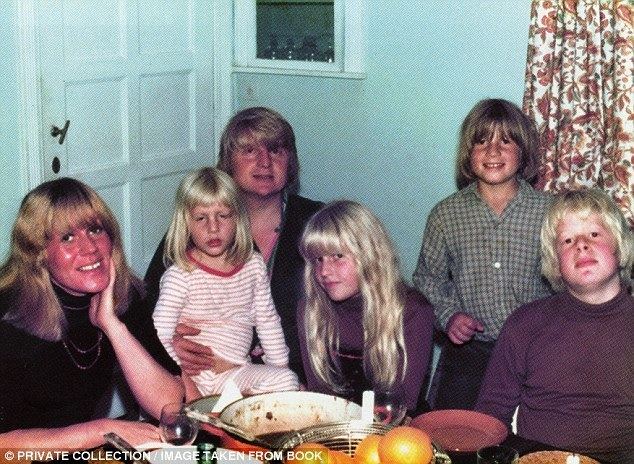 Stanley Johnson and Charlotte Johnson Wahl smiling with their four children