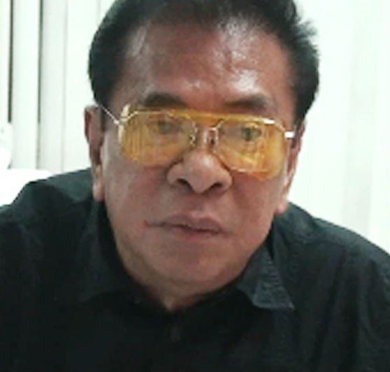 Chavit Singson wearing a black shirt and a pair of yellow eyeglasses