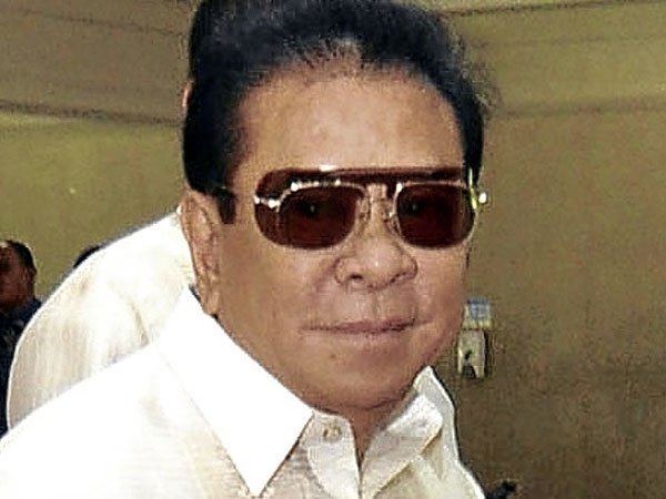 Chavit Singson wearing a white shirt and a pair of sunglasses