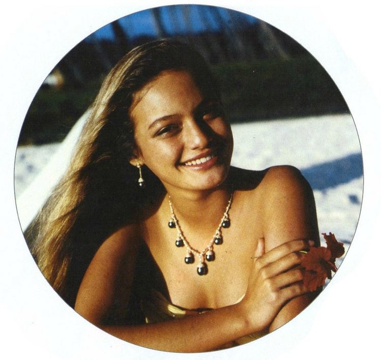 Smiling Cheyenne Brando wearing a necklace
