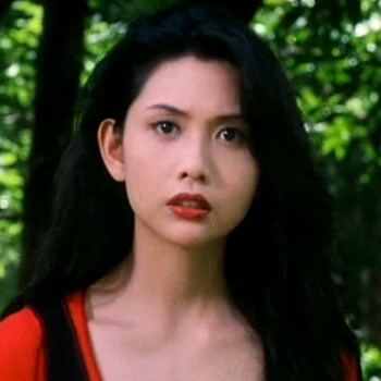 Chingmy Yau's serious face while wearing a red and black blouse