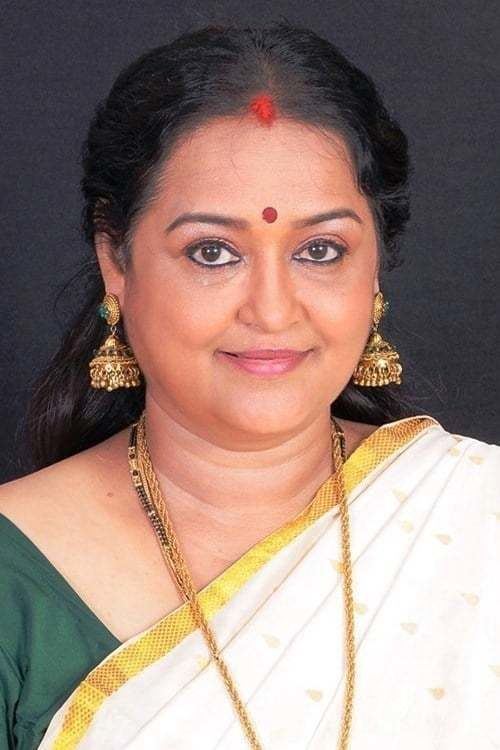 Chithra, a film actress wearing a necklace and earrings