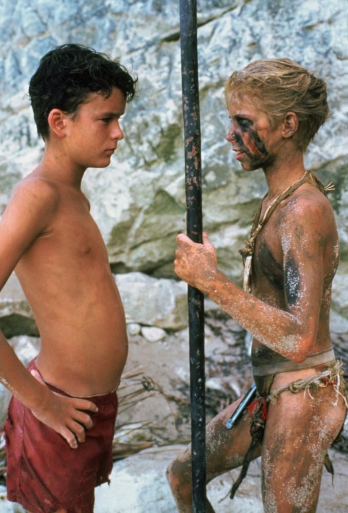 Balthazar Getty and Chris Furrh staring at each other in a scene from the 1990 American survival drama film, Lord of the Flies