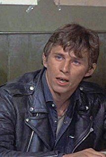 Young Christian Roberts wearing blue leather jacket