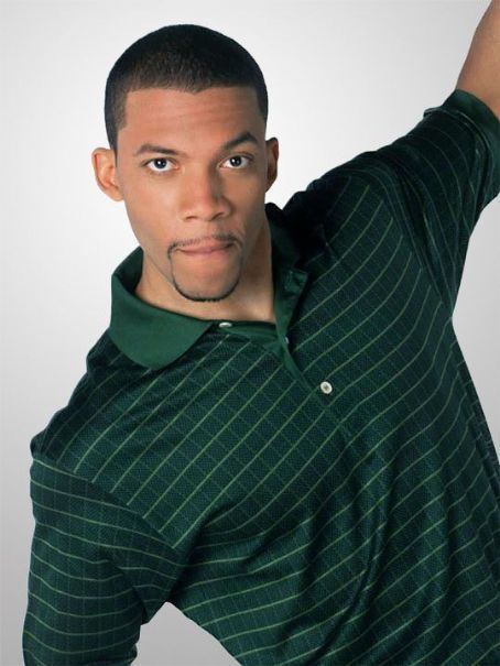 Christopher B. Duncan with serious face wearing a green collared shirt during his pictorial