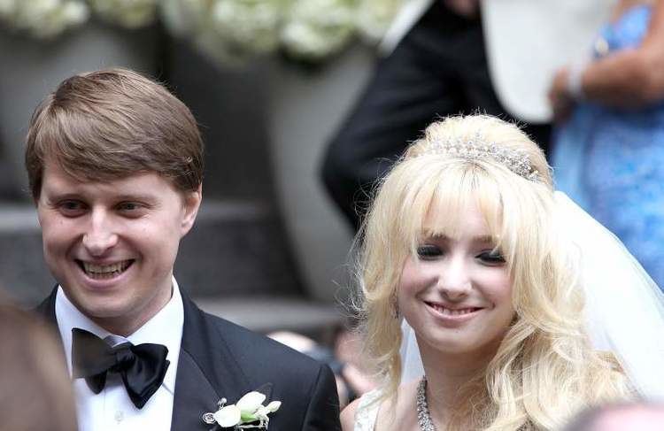 Christopher Nixon Cox smiling with Andrea Catsimatidis at their wedding day in New York City
