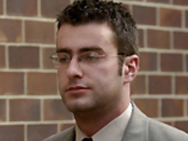 Christopher Porco wearing glasses and a brown outfit.