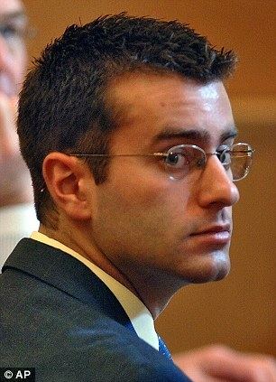 Christopher Porco appearing at court wearing glasses and a black suit.