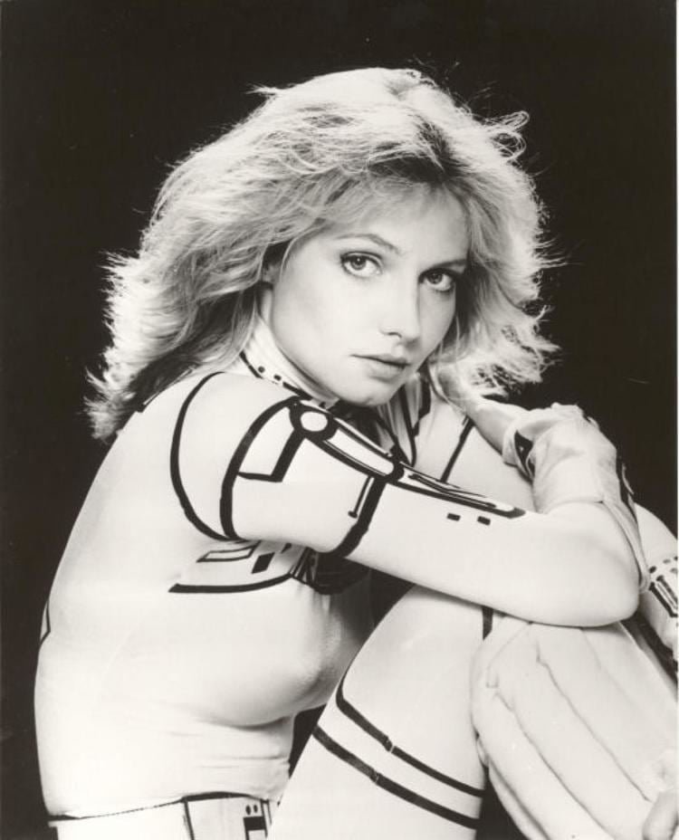 Cindy Morgan wearing a black and white long sleeve jumpsuit