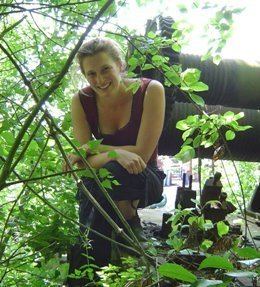 Claire Barratt surrounded by leaves