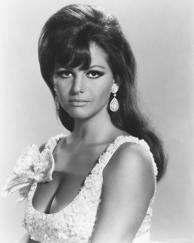 Claudia Cardinale wearing an earring and a sexy top with a ribbon