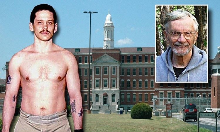 Clayton Fountain (left), with a serious face, has a black hair, mustache, chest hair, and tattoos on his left upper limb, left forearm, and right forearm, topless and wearing brown pants and a watch on his wrist on a photographed with an edited background of the United States Medical Center for Federal Prisoners with an image of Fr W. Paul Jones (right) smiling, has a white hair, a beard, and mustache, wearing eyeglasses in a black shirt under his light blue hoodie jacket