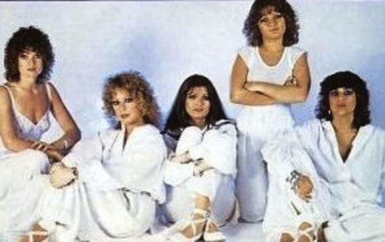 Cindy Alter, Ingrid "Ingi" Herbst, Glenda Hyam, Jenni Garson, and Sandy Robbie of Clout band wearing a white top and white pants