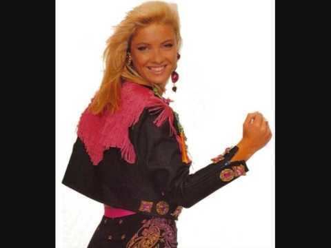 Collette Roberts with her blonde hair doing fist-pose during her pictorial