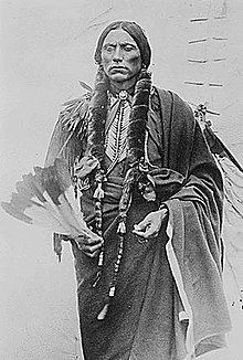 Quanah Parker, Cynthia's son, who became a feared Comanche tribal leader, wearing a robe