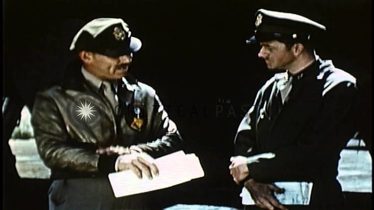 Combat America Captain Clark Gable talks to an officer during the shooting of