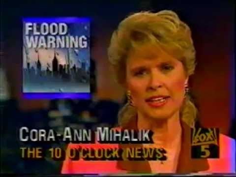 Cora-Ann Mihalik reporting a news on television about flood warning