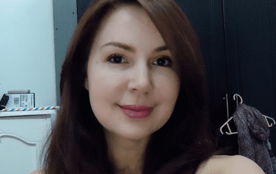 Cristina Gonzales while smiling