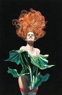 Maxine Hunkel as Cyclone, from the cover of Justice Society of America (vol. 3) #3, art by Alex Ross. Cyclone is smiling and floating in the air while her hands pulling her skirt downwards, she has a red long hair, wearing a white and red stripes thigh socks and a white sleeveless under a green off shoulder long sleeve dress