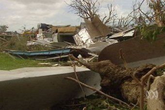 Impact of Cyclone Ingrid where houses and roads were destroyed.