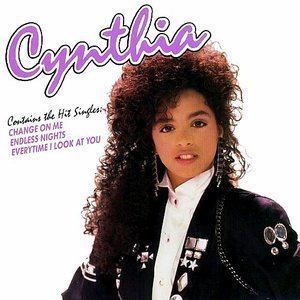 Cynthia on her album cover while wearing black jacket and white inner polo