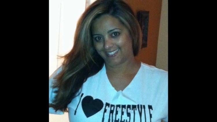 Cynthia smiling while wearing white shirt with a quote "I love freestyle"