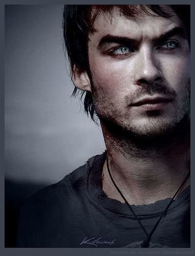 Damon Salvatore looking afar while wearing black shirt and necklace