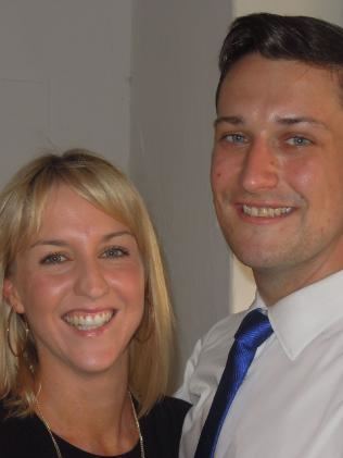 Katie Woolf (left) is smiling, has blonde hair, and wears big round hoop earrings, a silver necklace, and a black top. Dan Bourchier (right) is smiling, has black hair, wearing white long sleeves and a royal blue necktie.