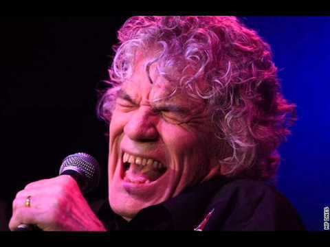 Dan McCafferty singing with a curly hair