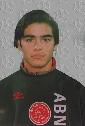 Daniel da Cruz Carvalho wearing a black, red, and white turtle-neck shirt