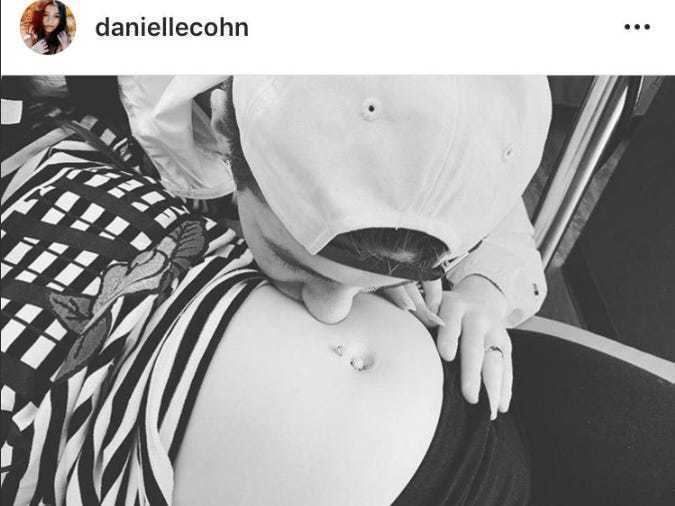 Danielle Cohn's photo on social media shows her big tummy while Mikey Tua kissing her stomach and wearing a cap.