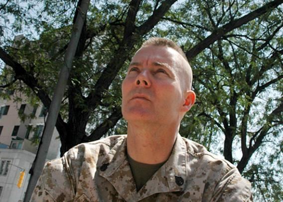 Dave Karnes looking afar while wearing a marine uniform
