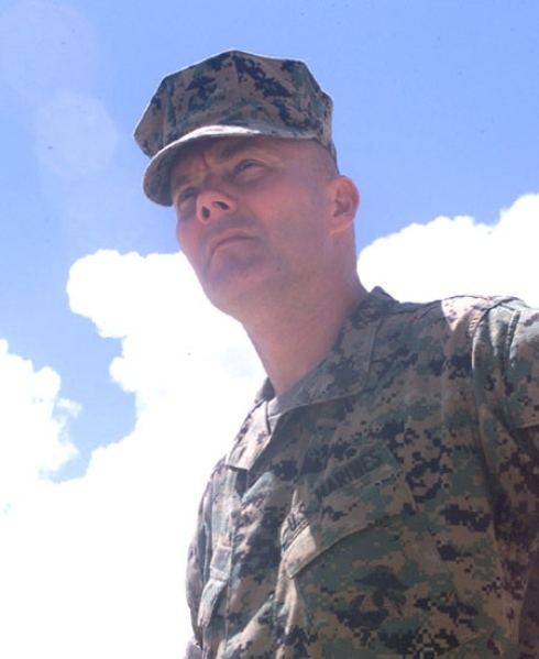Dave Karnes looking afar while wearing a marine uniform