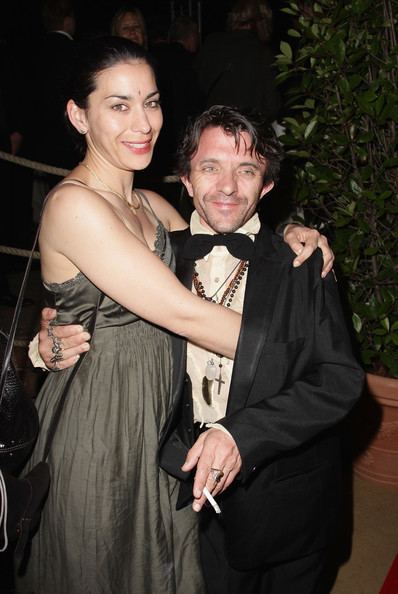 Kavita smiling while hugging David Bennent at the German Films Reception at Carlton Hotel during the 63rd Annual Cannes Film Festival